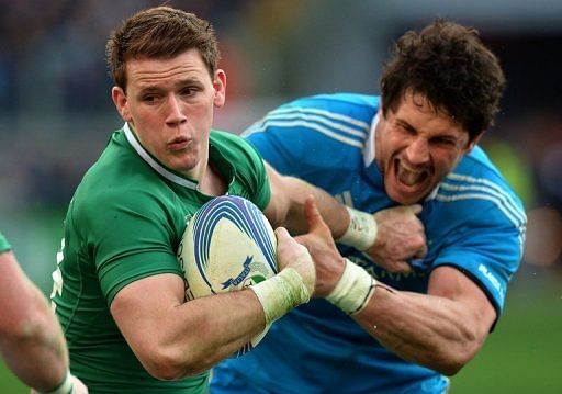 Ireland's Iain Henderson (L) is tackled by Italy's Alessandro Zanni during their Six Nations match on March 16, 2013